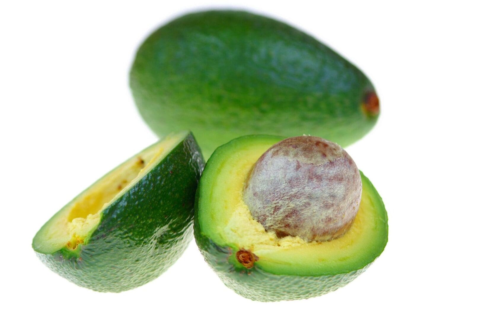 A close up of an avocado cut in half