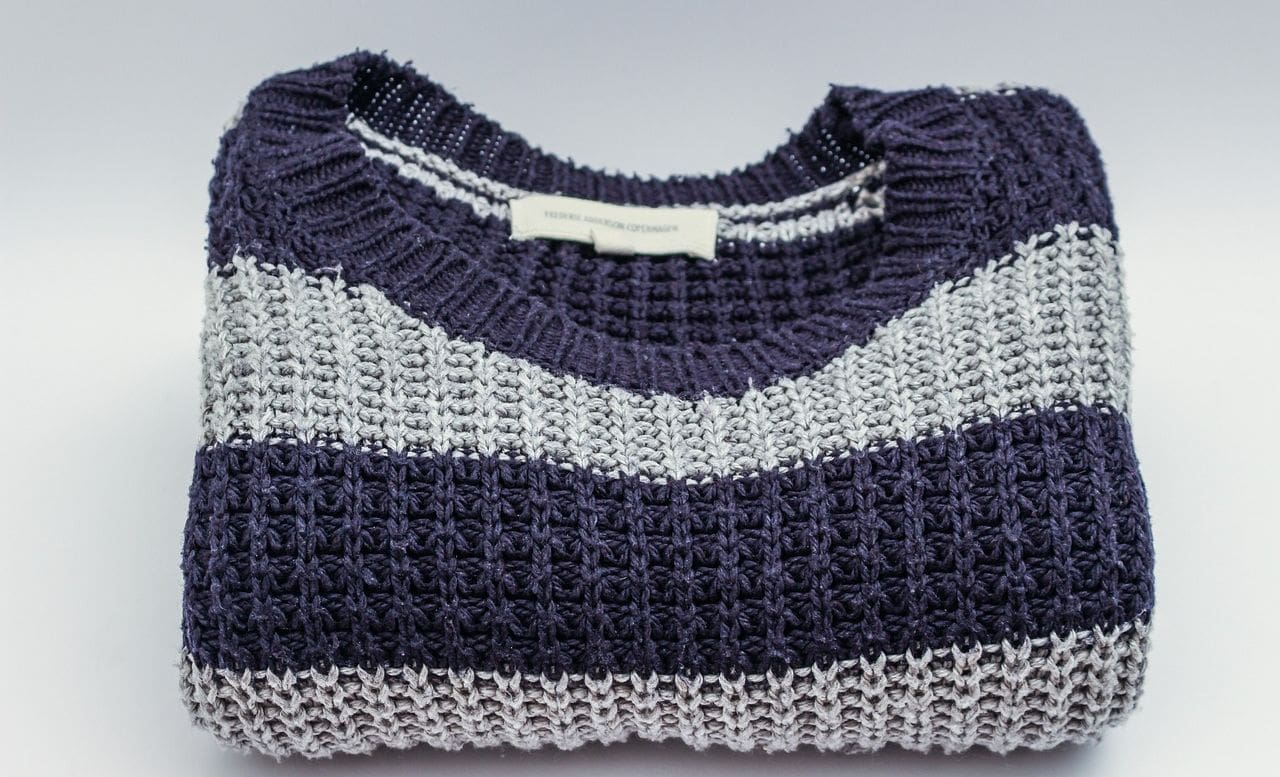 A sweater with stripes on it is shown.