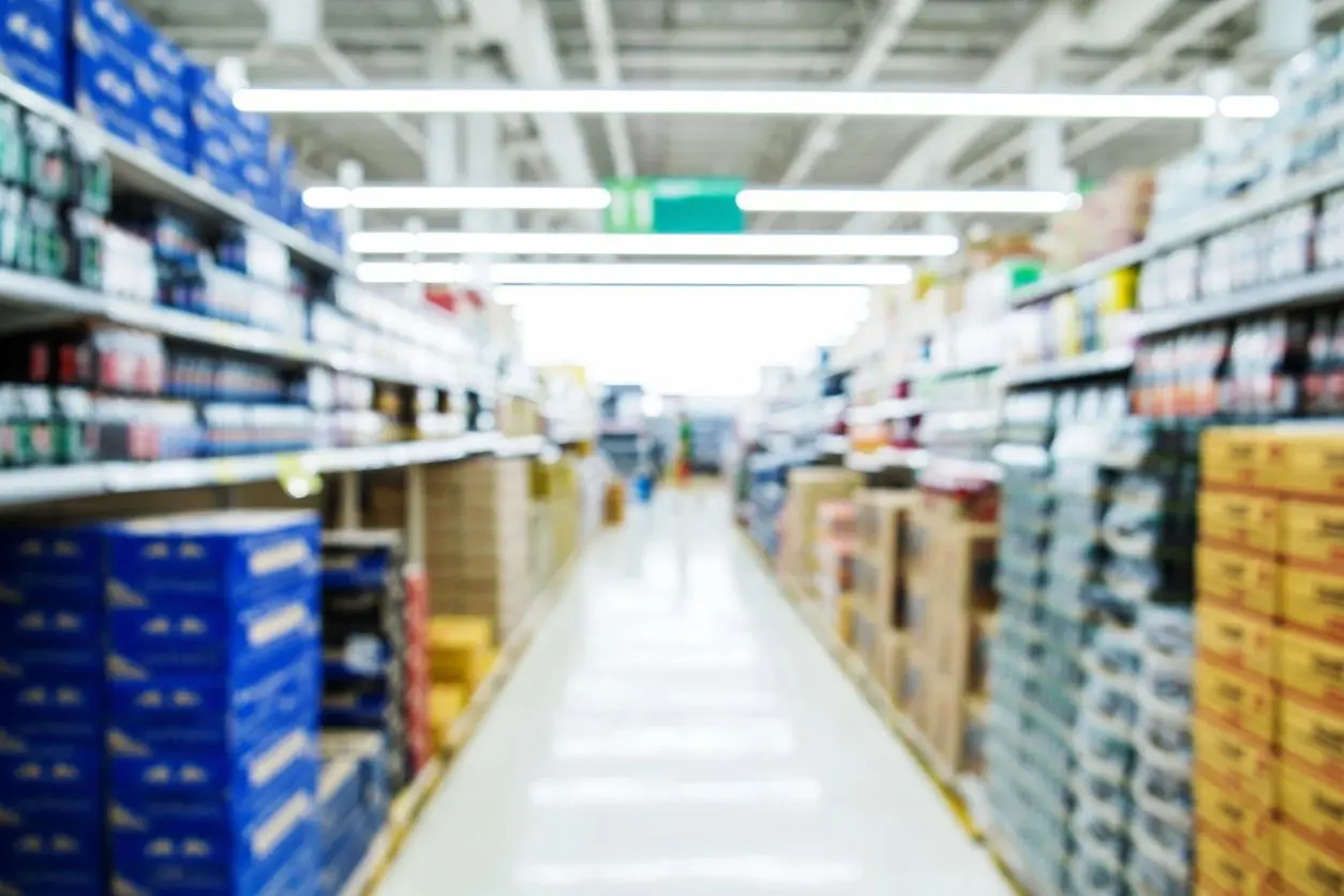 A blurry picture of the aisle in a store.