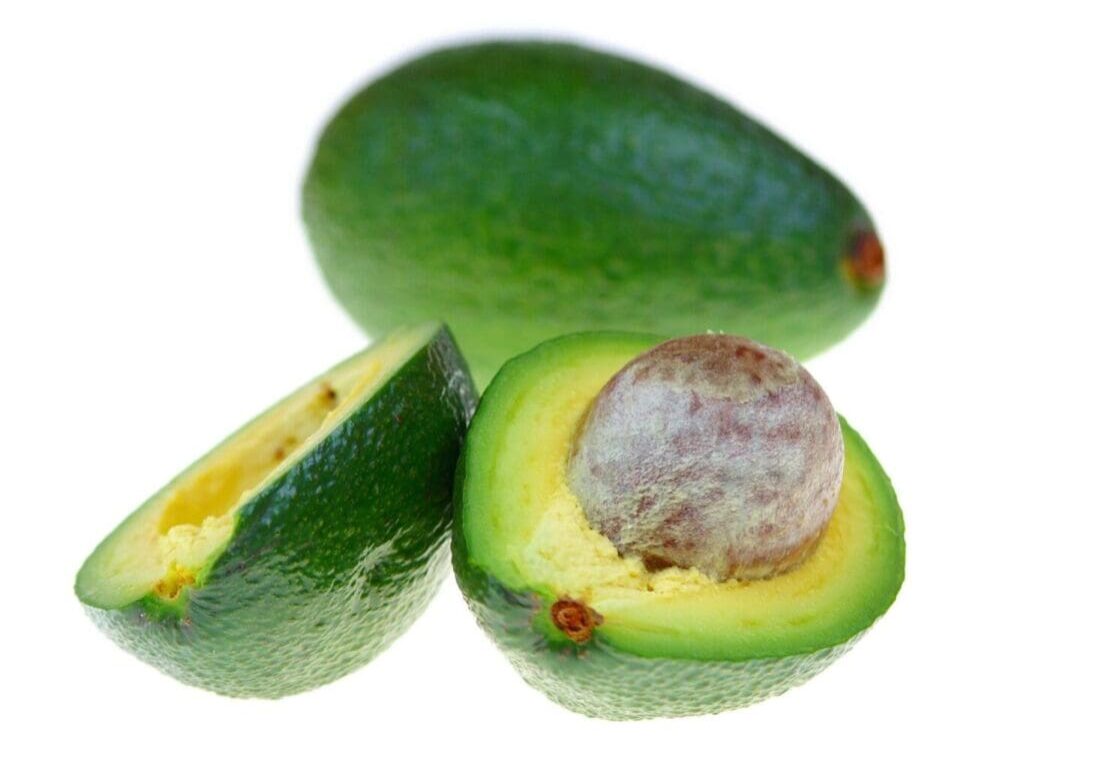 A close up of an avocado cut in half